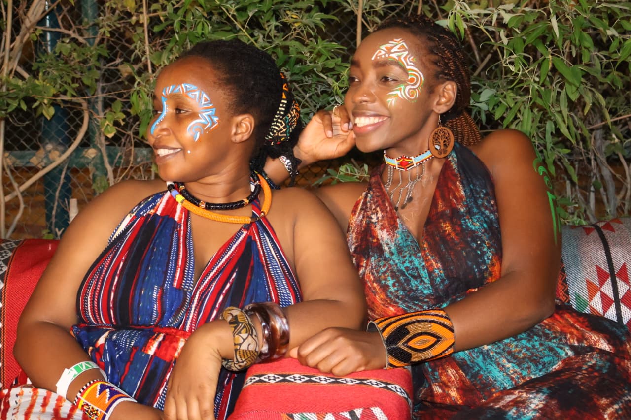 Brass musician playing under colored lights